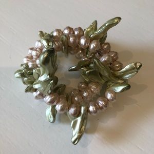 Pink and green beaded twisted bracelet